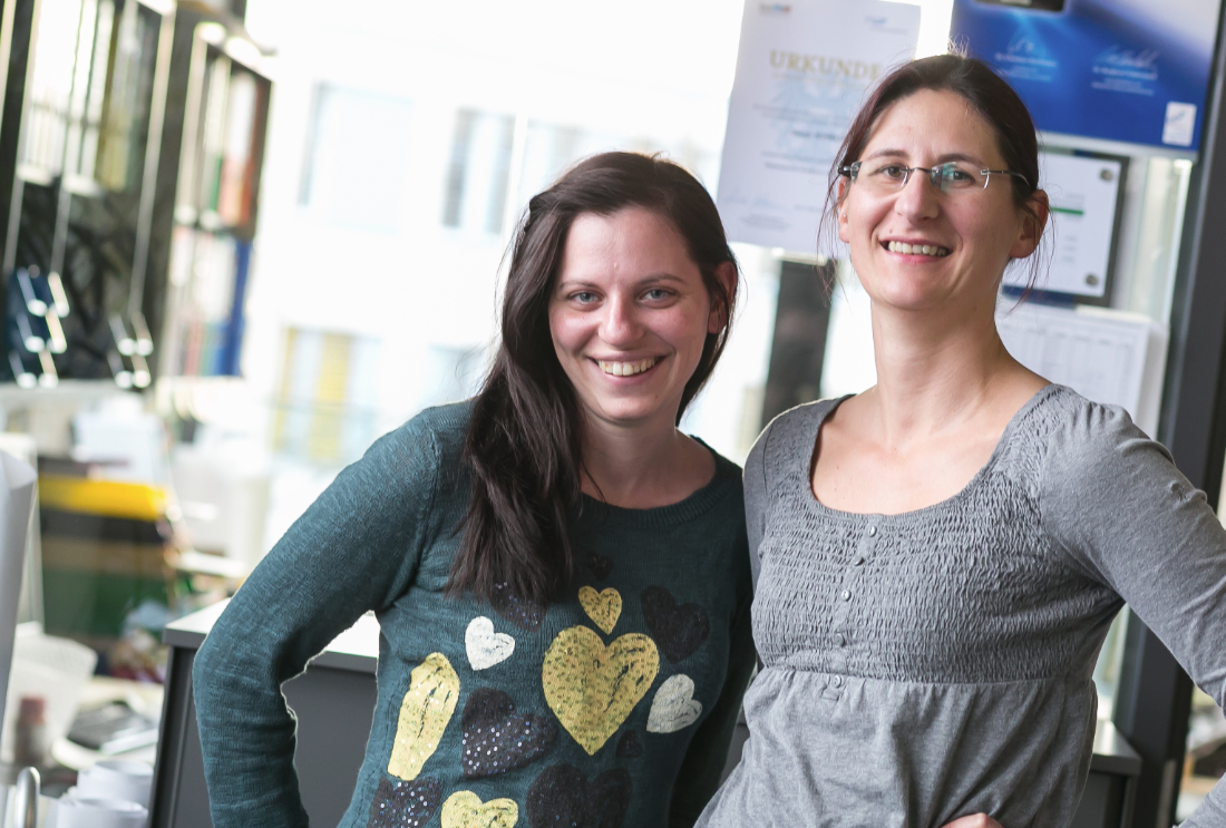 Two female scientists in civilian clothes in the laboratory